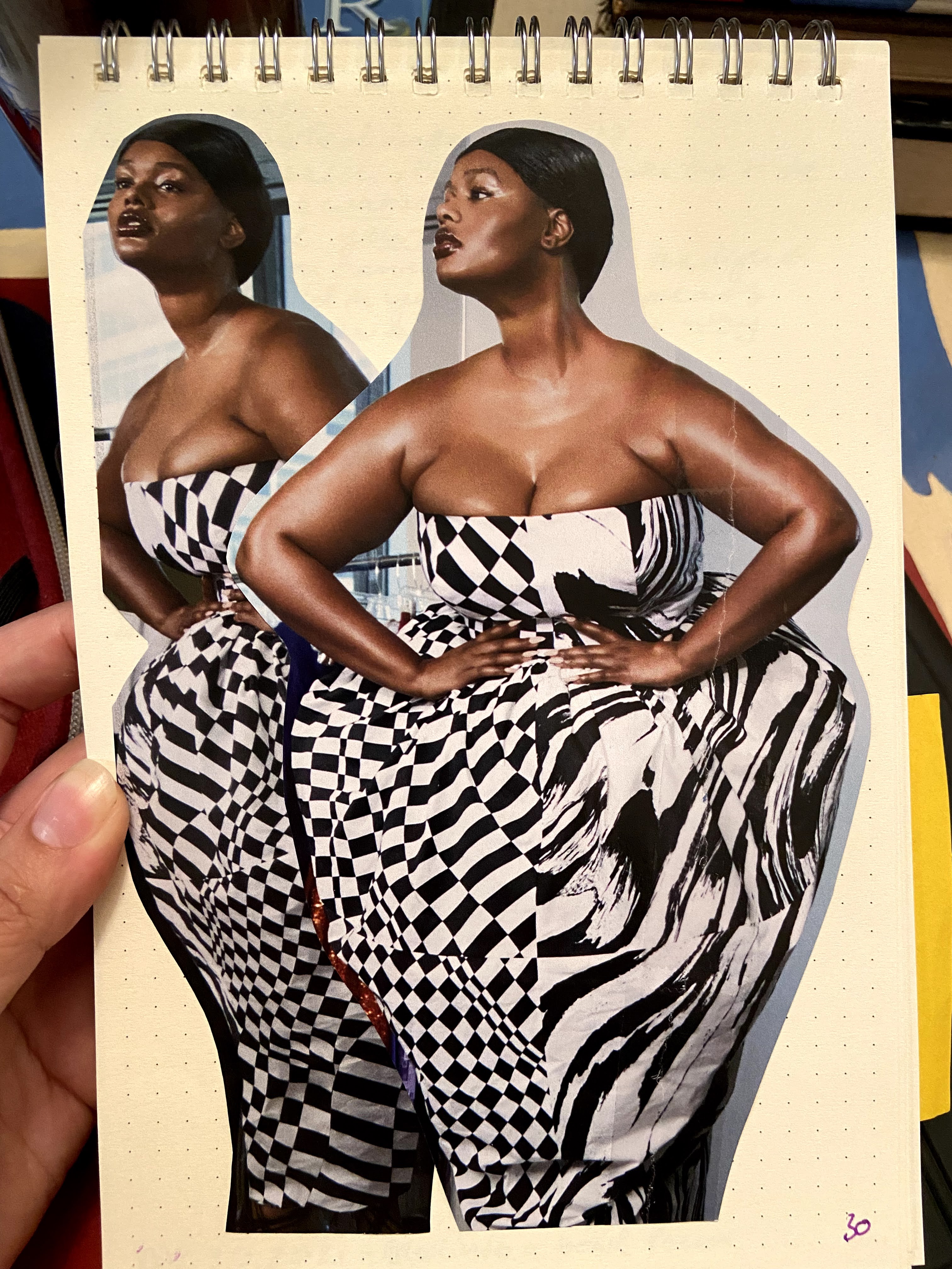 Black woman in a black and white dress